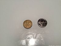 Front view of both coins showing obverse designs