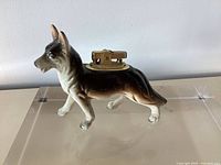 Side view of porcelain dog lighter showing glaze and lighter insert