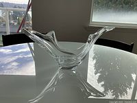 Side view of clear crystal centerpiece bowl on table
