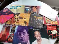 Overview of all album covers spread on table