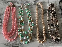 All six necklaces laid out for full view