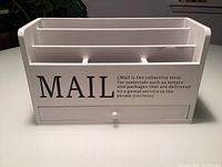 Front view showing MAIL text, three compartments, drawer