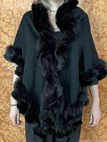 Front view of shawl worn, showing drape and fur trim