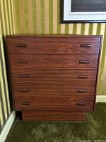 Front view of the dresser showing five drawers and integrated handles