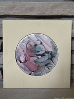 Full view of the signed, circular painted ceramic tile mounted on a square backing showing the abstract design and color tones.