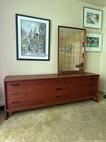 Full front view of teak dresser with mirror attached on right side
