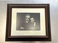 Overall view of framed etching including mat and wood frame