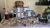 Full table view showing boxes, ring holders, necklaces, bracelets, brooches and perfume bottles