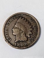 Obverse side showing Liberty with Native American headdress and date 1902
