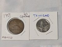 Two coins shown side by side, the left is a 1959 Mexico 20 Centavos coin, the right is a Trinidad 5 Cents coin in holders with handwritten labels.