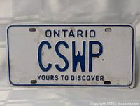Full view of Ontario white and blue license plate with letters 'CSWP'