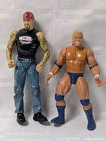 Pair of two rubber plastic wrestler figures shown side by side