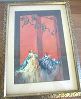 Full frontal image of the framed watercolor painting showing ladies in ballgowns with a red folding screen decorated with cranes.