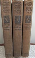 Spines of volumes I, II and III showing title text and edition stamp.