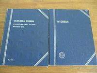 Front covers of two blue vintage Canadian nickel collector books featuring embossed coin slot circles and white text.