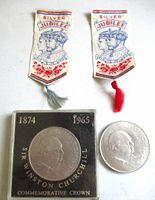 Two Sir Winston Churchill commemorative crown coins and two Silver Jubilee ribbons with red and grey tassels