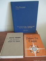 Lot of three vintage books about Hudson's Bay Company and fur trade, showing covers of 'The Beaver,' 'Arctic Trader,' and 'Hudson's Bay Company' books.
