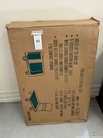 Cardboard box packaging for folding platform cart with model and features printed in blue and black text and images.