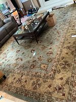Overview of full rug under coffee table in living room