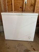 Front view of the white Arctic Wind chest freezer showing exterior with control dial.