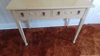 Full view of the painted small desk showing two drawers and straight legs on carpet.