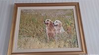 Full view of framed painting showing two dogs in a field with signature visible in bottom right corner.