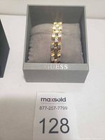 Bracelet displayed in Guess box on cushion
