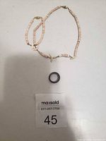 Necklace, bracelet, and wood ring overview