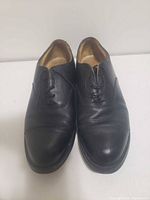 Front view of both black leather dress shoes