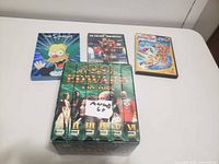 Front view of three DVDs and Edward The King VHS set