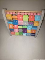 Front view showing rotating alphabet blocks