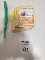 Bag of Pokémon cards, Pikachu card on top, lot label visible