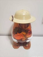 Front view of transparent Mr. Potato Head container showing contents