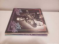 Stack of four LP records, top cover The Earl Scruggs Revue Anniversary Special