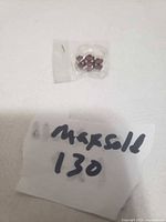 Ring in plastic sleeve with reference note