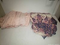 Both folded single bed sheets shown side by side