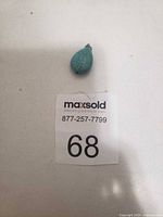 Front view of teardrop turquoise pendant with bail