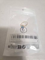 Ring sealed in retail bag showing size indicator 6 and product code