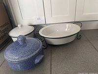 Group shot of three ceramic serving pieces illustrating overall lot