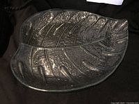 Overhead view of entire clear glass leaf plate
