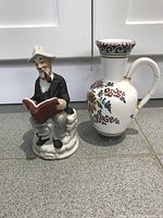 Front view of figurine and pitcher