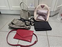 Group shot of all five bags laid on floor