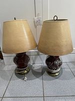 Pair of red glass lamps with shades