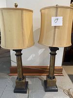 Front view of both lamps, shades off-light, showing design details