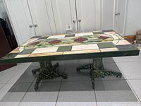 Full view of stained glass coffee table showing twin pedestal bases and mosaic top