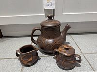 Teapot, creamer, sugar bowl front view