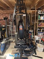 Front view of assembled Mega Max 3001 gym with seat, backrest, leg extension, weight stack and cable system visible