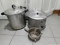 Pressure cooker, stock pot with lid, small sauce pot together