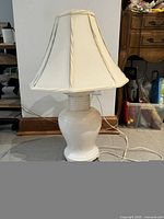 Full view of lamp showing ceramic base, shade, cord