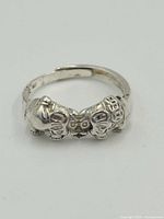 Front view of .999 silver ring featuring two elephants facing each other.